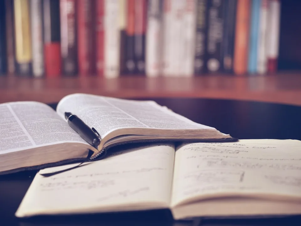 Open book and study materials representing professional publishing